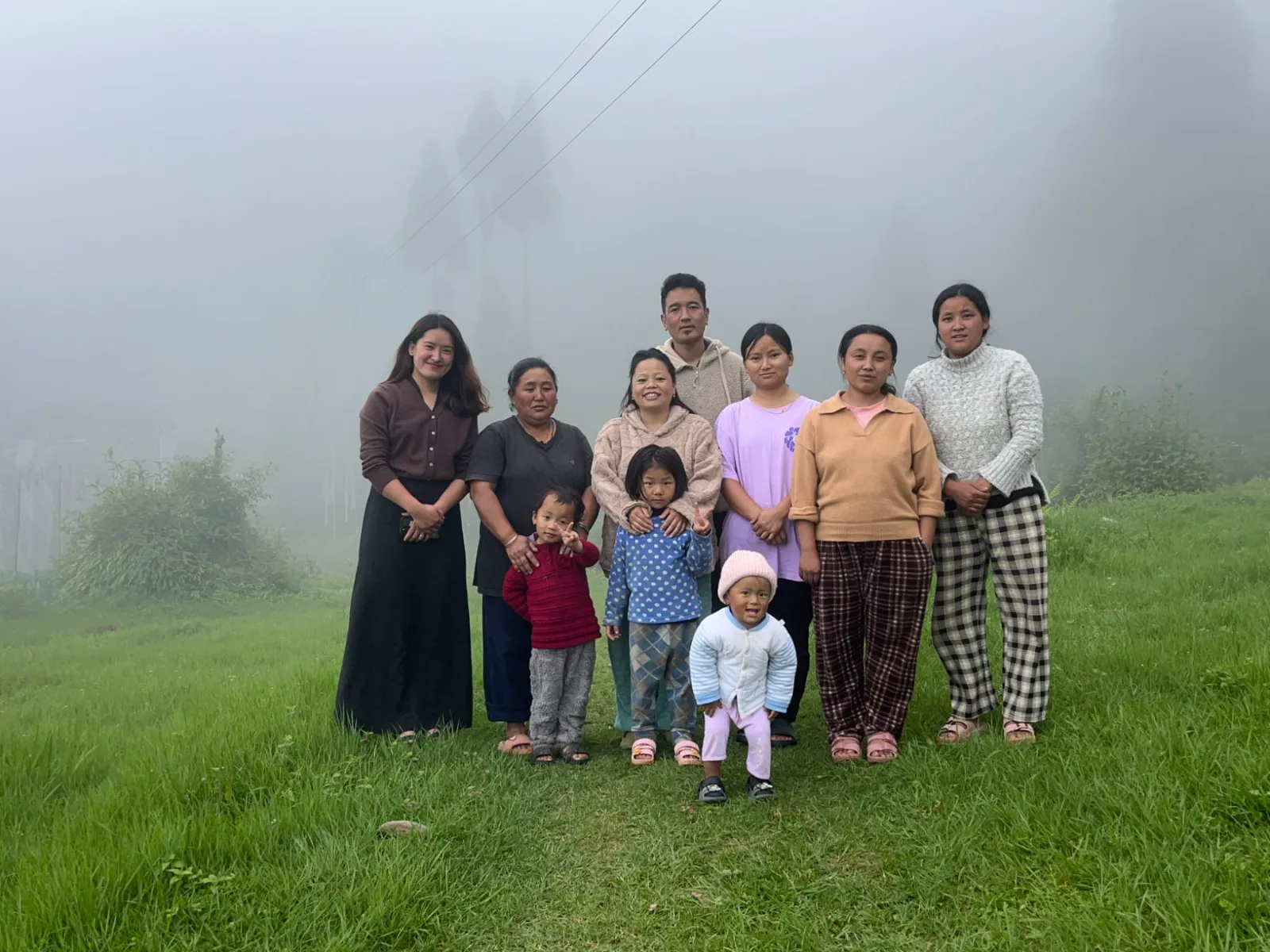 The Sherpa families of Gumpadara standing together in the mist